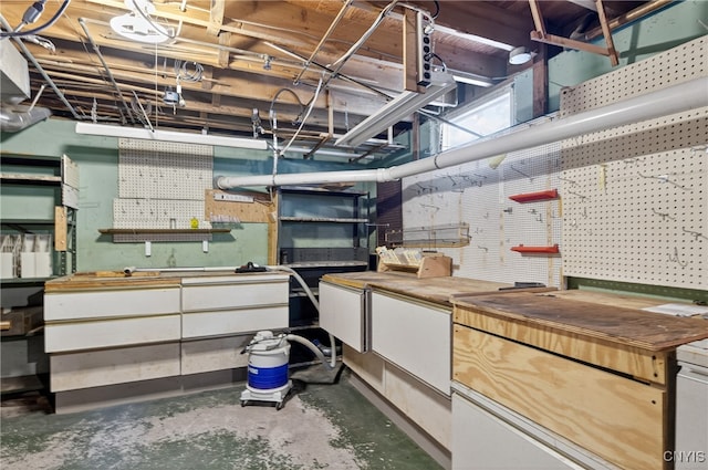 7165 Manlius Center Rd, Manlius, NY 13057 - unfinished basement featuring a workshop area