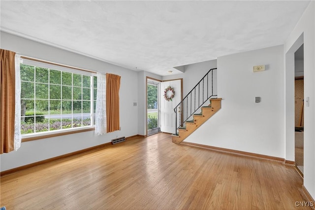 7165 Manlius Center Rd, Manlius, NY 13057 - entryway with wood finished floors and stairs