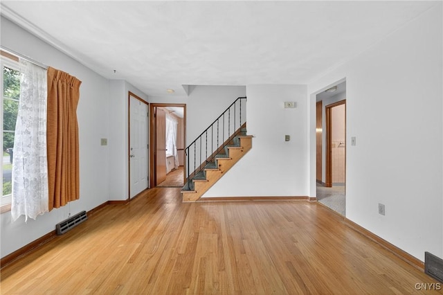 7165 Manlius Center Rd, Manlius, NY 13057 - foyer with light wood-type flooring and stairway