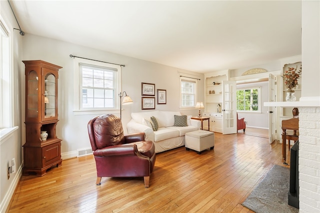 36 Dover Park, Brighton, NY 14610 - living area featuring light wood-style flooring and a fireplace