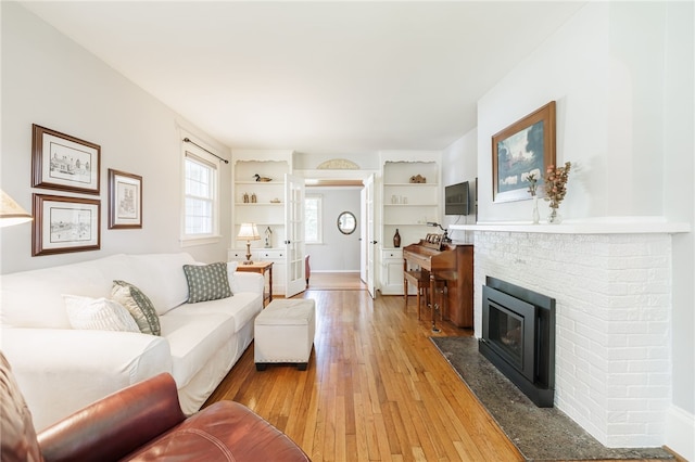 36 Dover Park, Brighton, NY 14610 - living room with light wood-type flooring and a fireplace