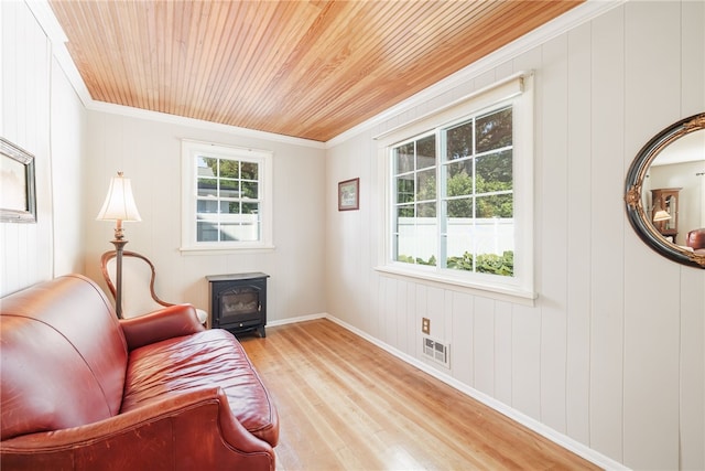 36 Dover Park, Brighton, NY 14610 - sitting room with a wood stove, light wood-type flooring, wooden ceiling, and ornamental molding
