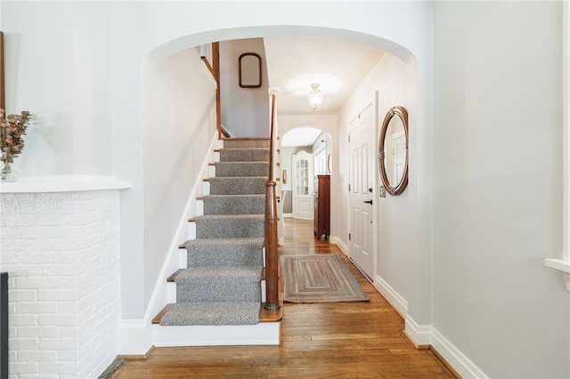 36 Dover Park, Brighton, NY 14610 - foyer featuring wood finished floors, arched walkways, and stairway