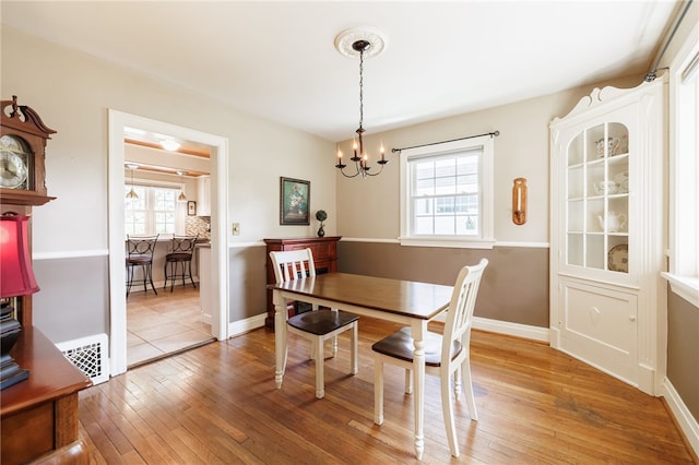36 Dover Park, Brighton, NY 14610 - dining space featuring a chandelier and light wood-style flooring