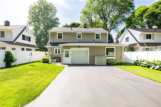36 Dover Park, Brighton, NY 14610 - view of front facade featuring asphalt driveway, a garage, and a chimney