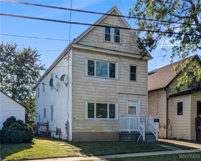 386 Davey St, Buffalo, NY 14206 - rear view of house with a yard