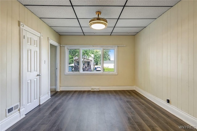386 Davey St, Buffalo, NY 14206 - unfurnished dining area with dark wood-type flooring, wooden walls, and a paneled ceiling