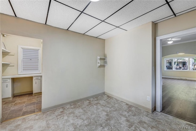 386 Davey St, Buffalo, NY 14206 - spare room featuring a drop ceiling, a ceiling fan, and built in study area