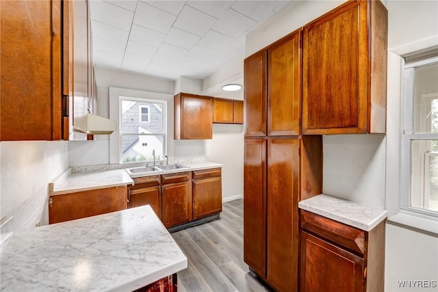 386 Davey St, Buffalo, NY 14206 - kitchen featuring dark wood finished floors, plenty of natural light, brown cabinets, and light countertops