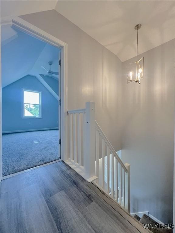 155 Barnsdale Ave, West Seneca, NY 14224 - staircase featuring vaulted ceiling, wood finished floors, and a chandelier