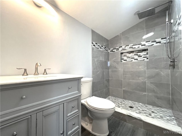 155 Barnsdale Ave, West Seneca, NY 14224 - full bathroom featuring a tile shower, lofted ceiling, vanity, and wood finished floors