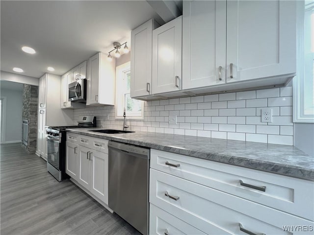 155 Barnsdale Ave, West Seneca, NY 14224 - kitchen with stainless steel appliances, light wood-type flooring, white cabinetry, dark stone countertops, and recessed lighting