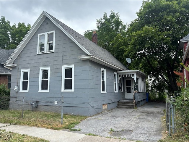 38 Cedar St, Rochester, NY 14611 - view of front facade with a chimney, crawl space, and roof with shingles