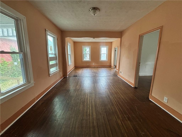 38 Cedar St, Rochester, NY 14611 - spare room featuring dark wood-style flooring and a textured ceiling
