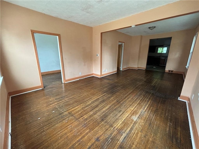 38 Cedar St, Rochester, NY 14611 - unfurnished living room with hardwood / wood-style flooring and a textured ceiling