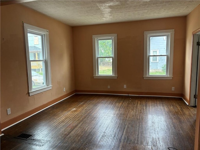 38 Cedar St, Rochester, NY 14611 - unfurnished room featuring wood finished floors and a textured ceiling
