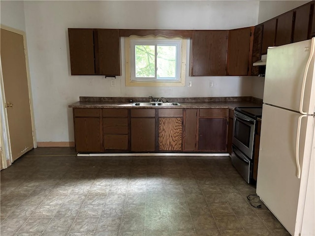38 Cedar St, Rochester, NY 14611 - kitchen with dark countertops, freestanding refrigerator, stainless steel range with electric cooktop, and extractor fan