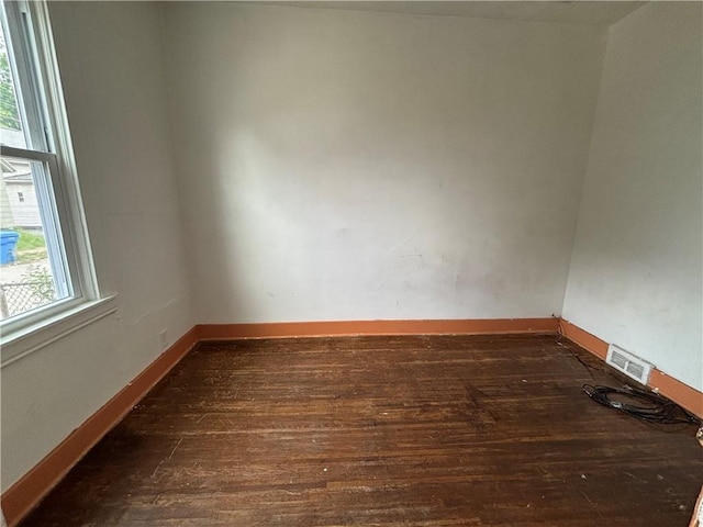 38 Cedar St, Rochester, NY 14611 - empty room with wood finished floors and baseboards