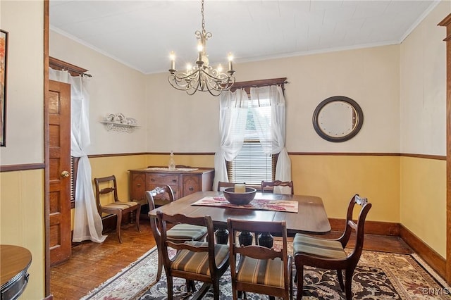 315 Boyden St, Syracuse, NY 13203 - dining room with wood-type flooring, a chandelier, and ornamental molding