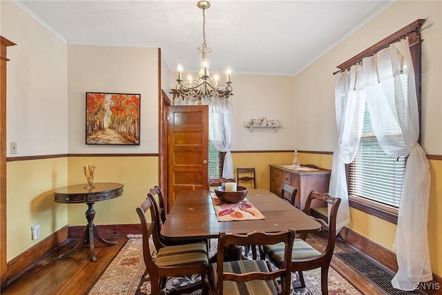 315 Boyden St, Syracuse, NY 13203 - dining room featuring wood finished floors, a chandelier, and crown molding