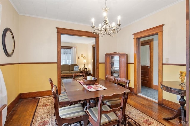 315 Boyden St, Syracuse, NY 13203 - dining area with hardwood / wood-style flooring, a chandelier, and crown molding