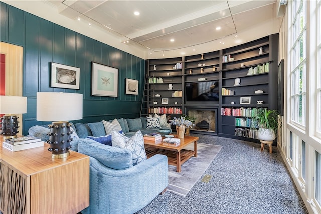 3399 Elmwood Ave, Brighton, NY 14610 - living room featuring built in features, speckle patterned floor, and a fireplace
