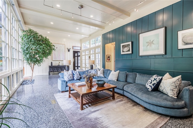 3399 Elmwood Ave, Brighton, NY 14610 - living area with beamed ceiling, a decorative wall, and speckled floor