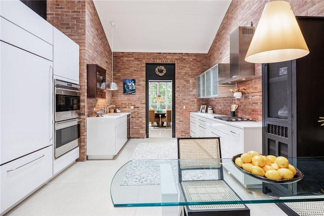 3399 Elmwood Ave, Brighton, NY 14610 - kitchen featuring wall chimney range hood, stainless steel double oven, light countertops, white cabinetry, and modern cabinets