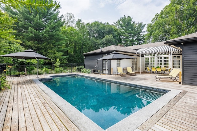 3399 Elmwood Ave, Brighton, NY 14610 - view of pool with a wooden deck, outdoor dining area, and view of scattered trees