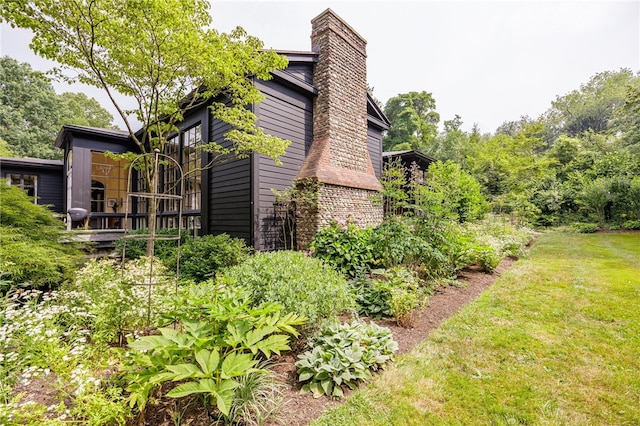 3399 Elmwood Ave, Brighton, NY 14610 - view of property exterior featuring a chimney and a yard