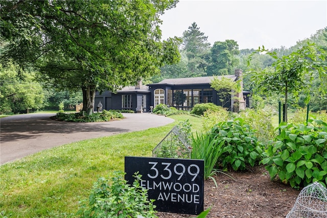 3399 Elmwood Ave, Brighton, NY 14610 - view of front of house featuring a chimney and a front lawn