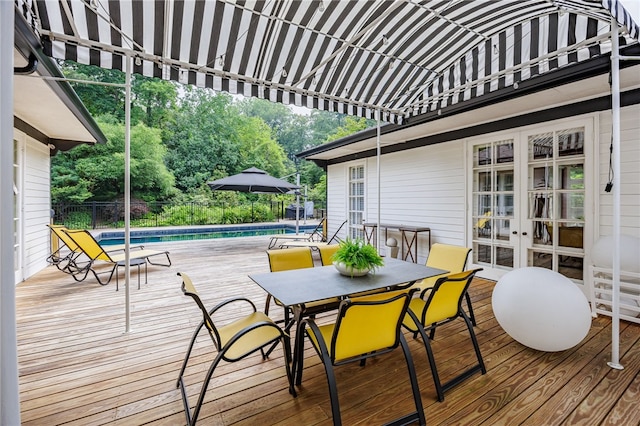 3399 Elmwood Ave, Brighton, NY 14610 - deck with french doors, an outdoor pool, and outdoor dining space