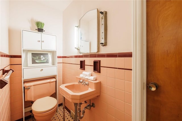 760 Beach Ave, Rochester, NY 14612 - half bathroom with tile walls and a wainscoted wall