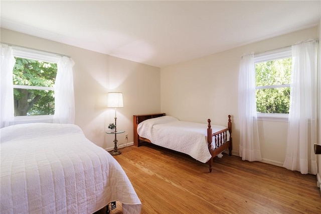 760 Beach Ave, Rochester, NY 14612 - bedroom featuring multiple windows and light wood-style floors
