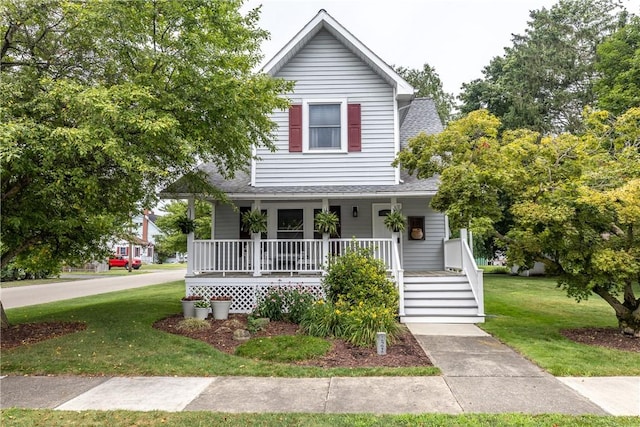 121 Reynolds Ave, Corning City, NY 14830 - view of front of home with a shingled roof, a porch, and a front lawn