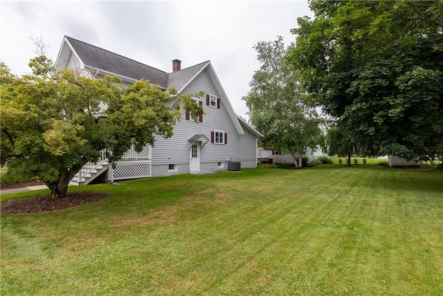121 Reynolds Ave, Corning City, NY 14830 - view of side of property with a lawn and a chimney