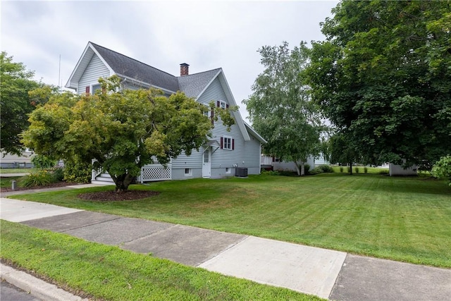 121 Reynolds Ave, Corning City, NY 14830 - view of home's exterior featuring a chimney and a yard