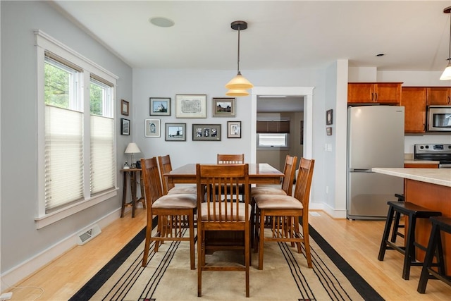 121 Reynolds Ave, Corning City, NY 14830 - dining space featuring light wood-type flooring and baseboards