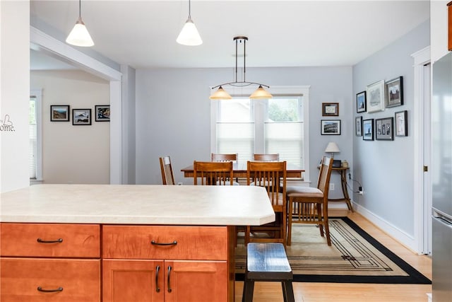 121 Reynolds Ave, Corning City, NY 14830 - dining space featuring light wood-style flooring and baseboards