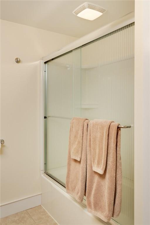 121 Reynolds Ave, Corning City, NY 14830 - full bathroom featuring bath / shower combo with glass door and tile patterned flooring
