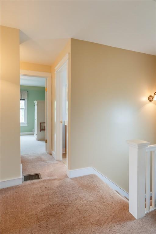 121 Reynolds Ave, Corning City, NY 14830 - hallway with carpet and an upstairs landing