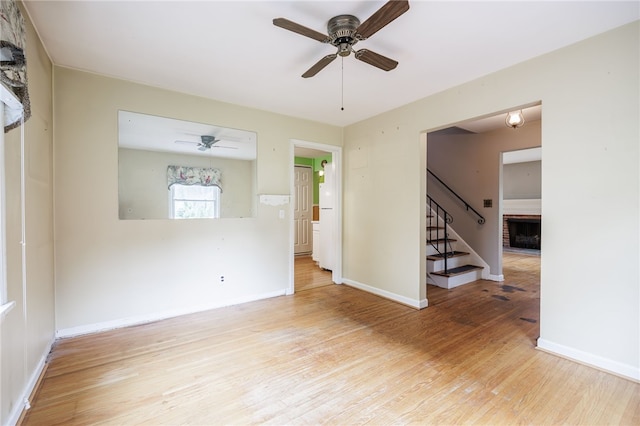 360 San Gabriel Dr, Rochester, NY 14610 - empty room with stairs, ceiling fan, and wood finished floors