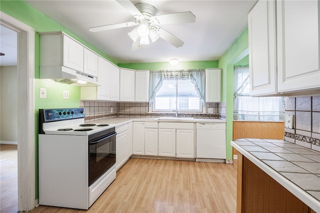 360 San Gabriel Dr, Rochester, NY 14610 - kitchen featuring white appliances, decorative backsplash, tile counters, and white cabinetry