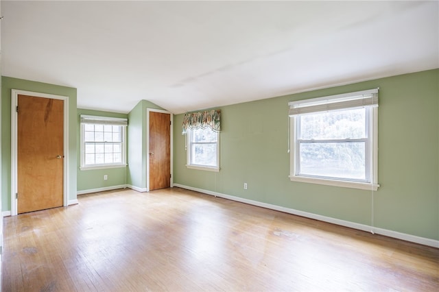 360 San Gabriel Dr, Rochester, NY 14610 - spare room featuring wood finished floors and vaulted ceiling