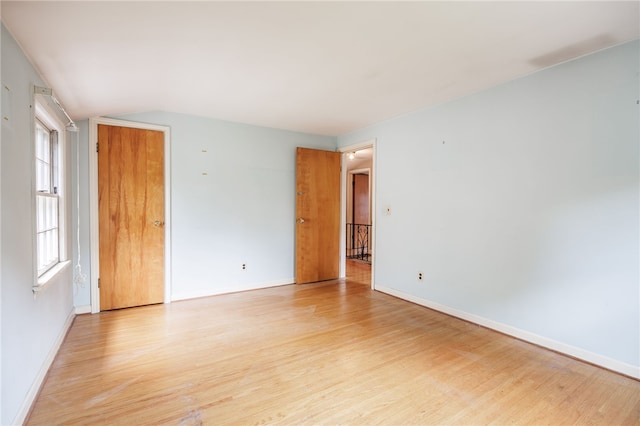 360 San Gabriel Dr, Rochester, NY 14610 - unfurnished room with light wood-type flooring and lofted ceiling