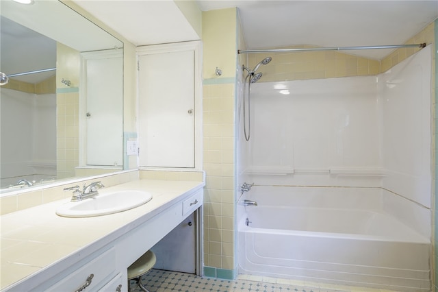 360 San Gabriel Dr, Rochester, NY 14610 - full bathroom featuring shower / washtub combination, vanity, tile walls, and tile patterned floors