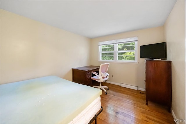 1018-20 Ackerman Ave, Syracuse, NY 13210 - bedroom featuring light wood-type flooring and baseboard heating
