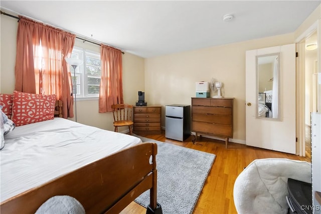 1018-20 Ackerman Ave, Syracuse, NY 13210 - bedroom with refrigerator and wood finished floors