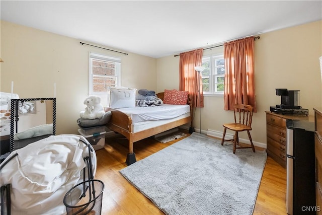 1018-20 Ackerman Ave, Syracuse, NY 13210 - bedroom featuring light wood-style floors and freestanding refrigerator