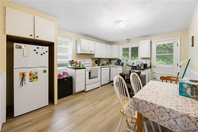 1018-20 Ackerman Ave, Syracuse, NY 13210 - kitchen with white appliances, light wood-style flooring, healthy amount of natural light, and white cabinets